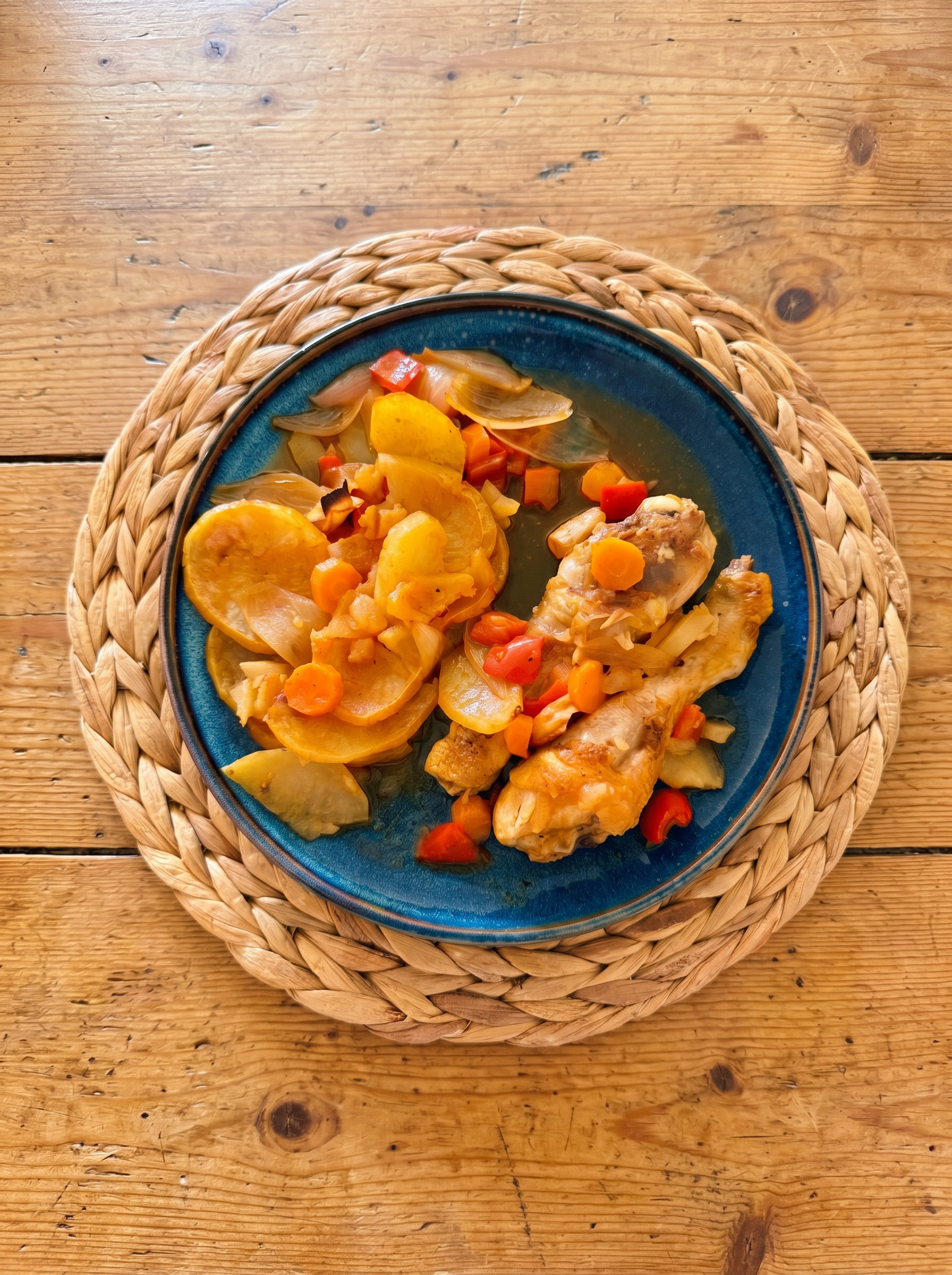 Braised chicken with potatoes, carrots and peppers